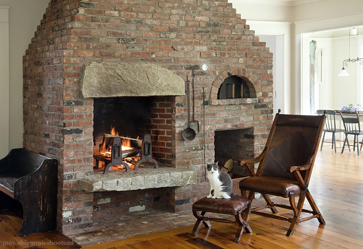 Cozy fireplace in a great room by D. Michael Collins Architects